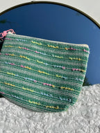 groen toilettasje met bloem sleutelhanger