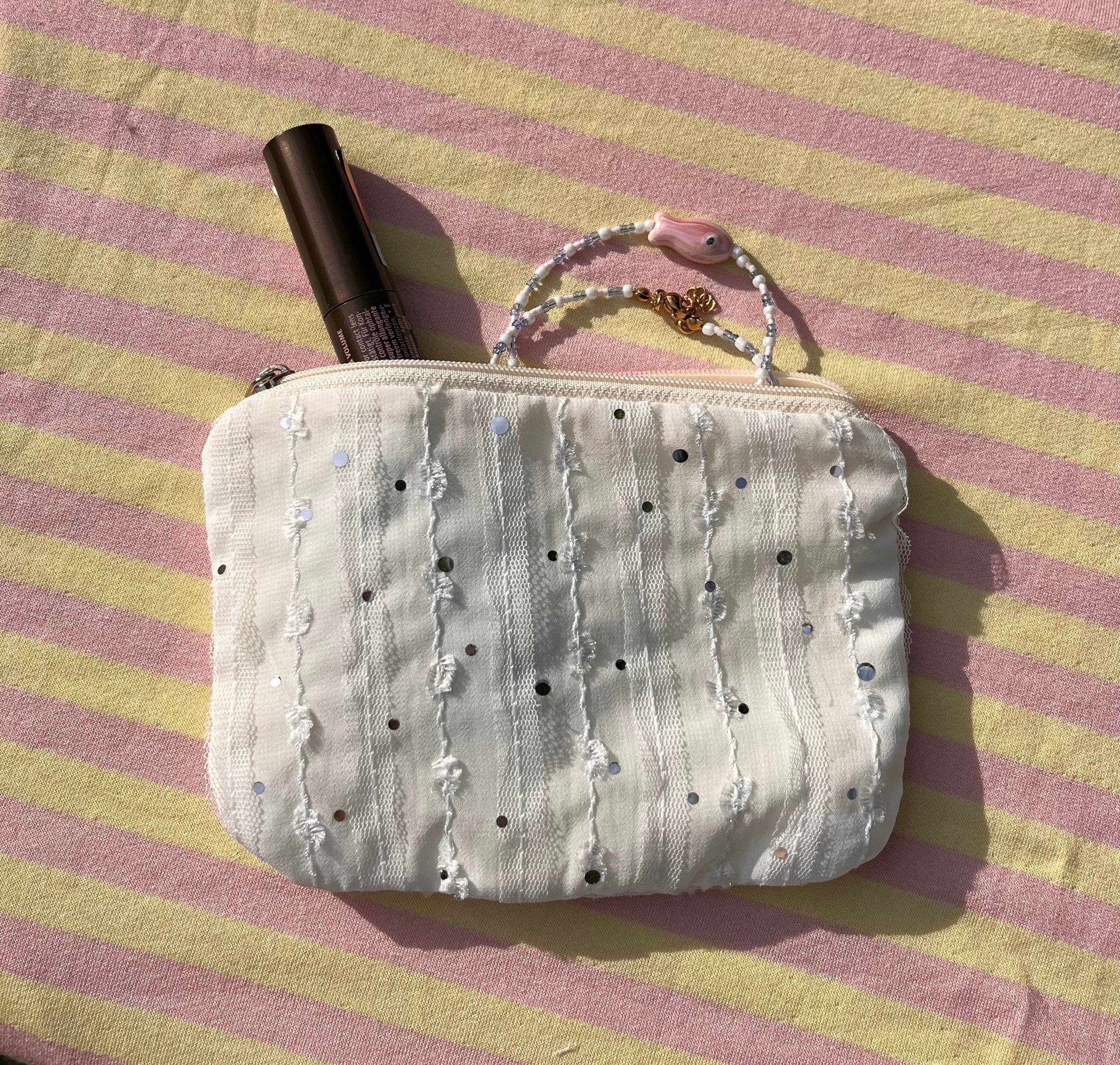 Wit toilettasje met pailletjes