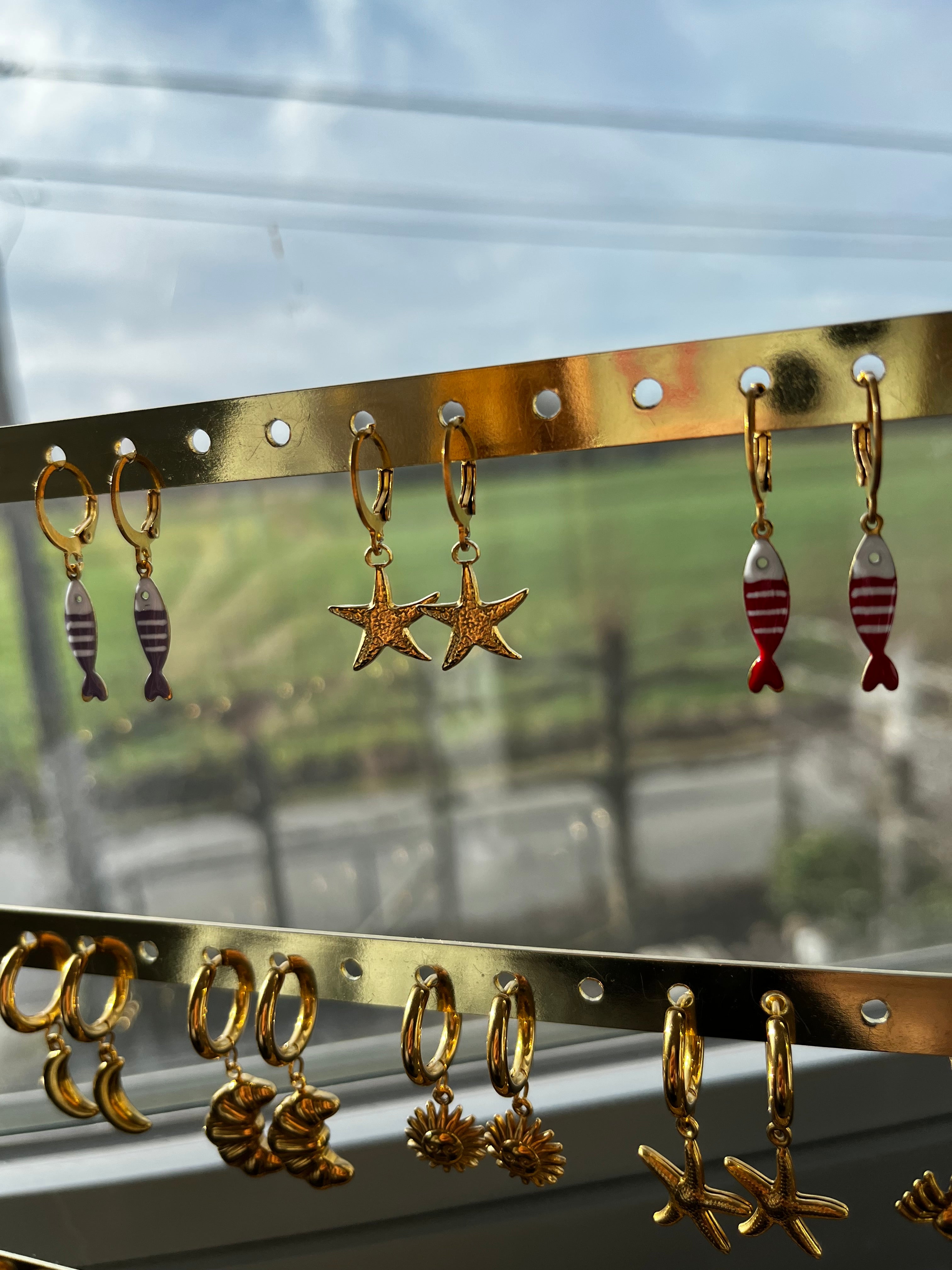 oorbel zeester klein goud