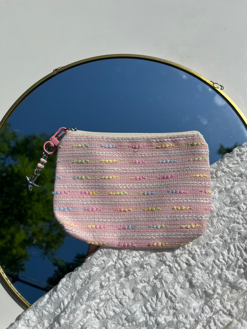 roze toilettas met zeester sleutelhanger