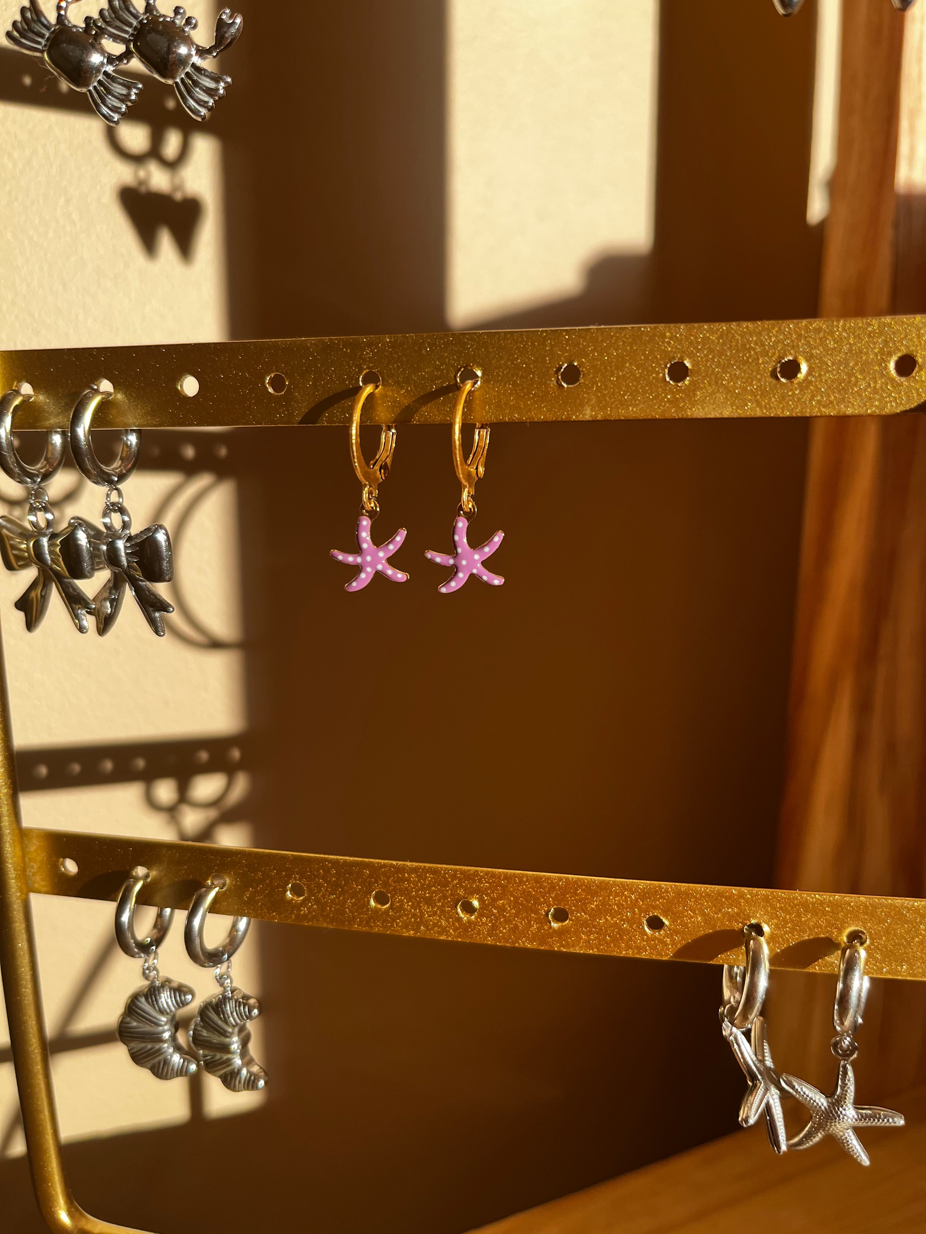 oorbel zeester paars goud